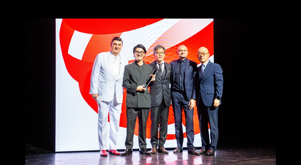 Persons on the image (from left to right) are Prof. Dr. Peter Zec (managing director Red Dot Group) Yasutake Tsuchida (Chief Designer of the All-New Mazda3), Ikuo Maeda (Head of Design), Jo Stenuit (European Design Director), and Prof. Dr. Ken Nah